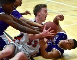 Jaylunn English, Kameron Fleming and Allen Perryman fight Hanford's Reynolds for the ball in Friday night's Bullpup victory over the Tigers.